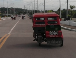 The typical tricycle on Panglao, that does not fit two travelers and their backpacks. They all have a bible verse on the back; we doubt that makes the driving any safer...